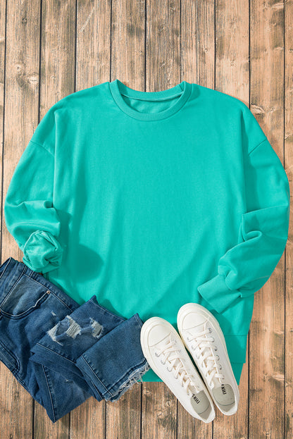 Aruba Blue Solid O Neck High Low Hem Pullover Sweatshirt