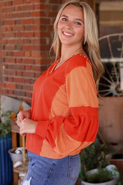 Fiery Red Studded V Neckline Exposed Seam Textured Knit Top